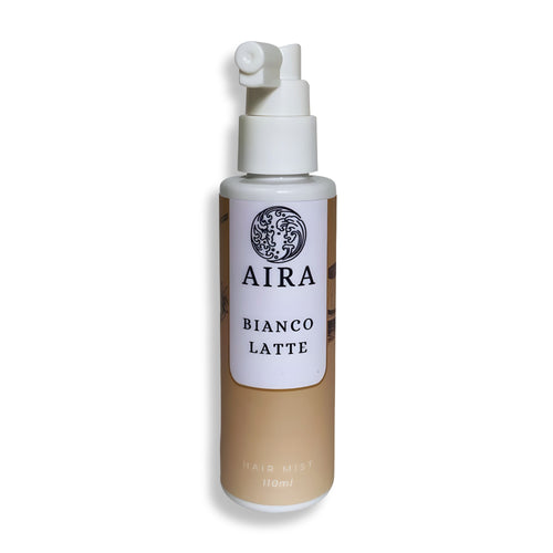 Bottle of AIRA Bianco Latte hair mist on a white background