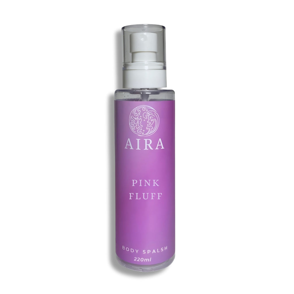 Purple bottle of AIRA Pink Fluff body splash on a white background