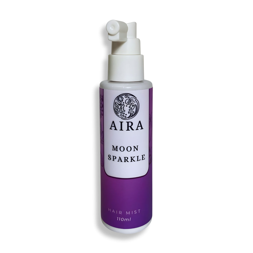 Purple bottle of AIRA Moon Sparkle hair mist on a white background