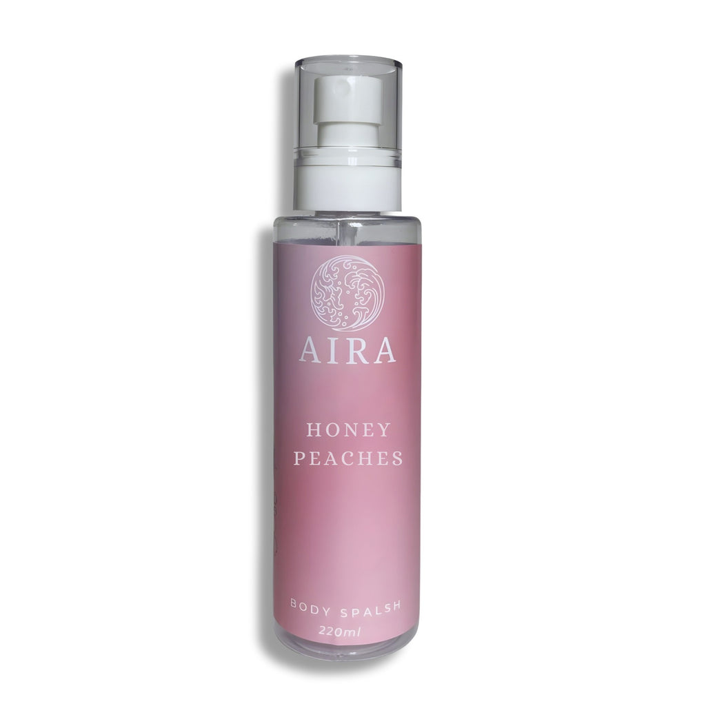 Bottle of AIRA Honey Peaches body splash on a white background Scandal dupe
