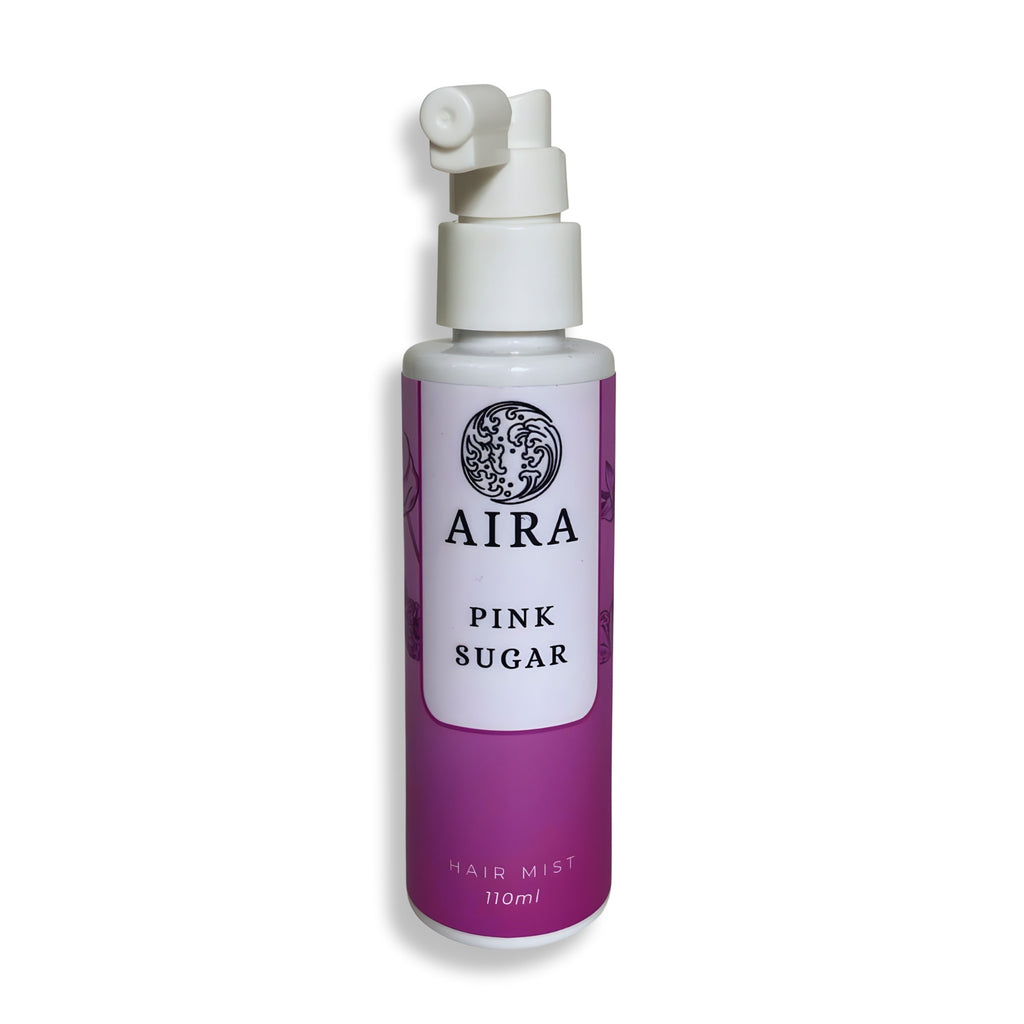 Purple hair mist bottle labeled 'AIRA Pink Sugar' on a white background