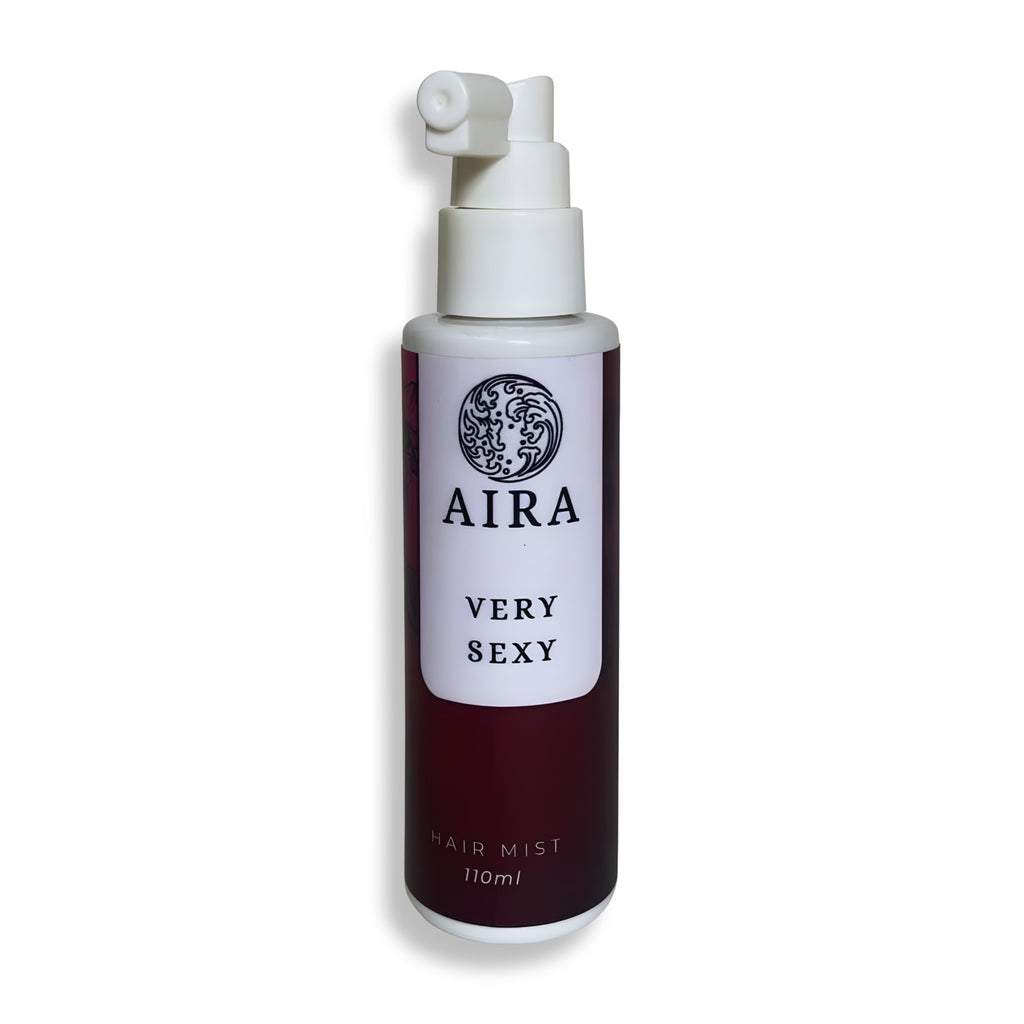 Aira hair mist bottle with maroon and white design on a white background