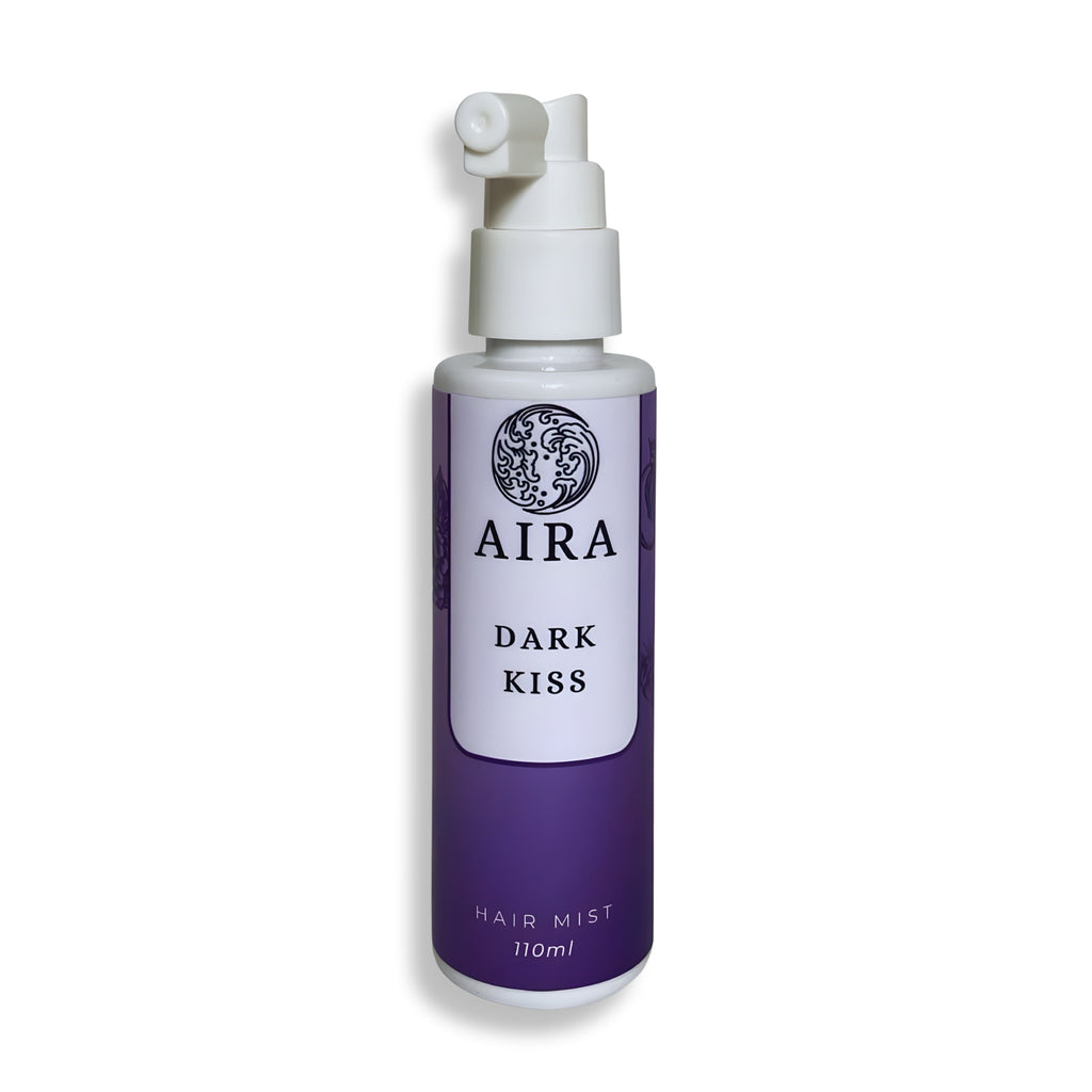 Purple bottle of AIRA Dark Kiss hair mist on a white background