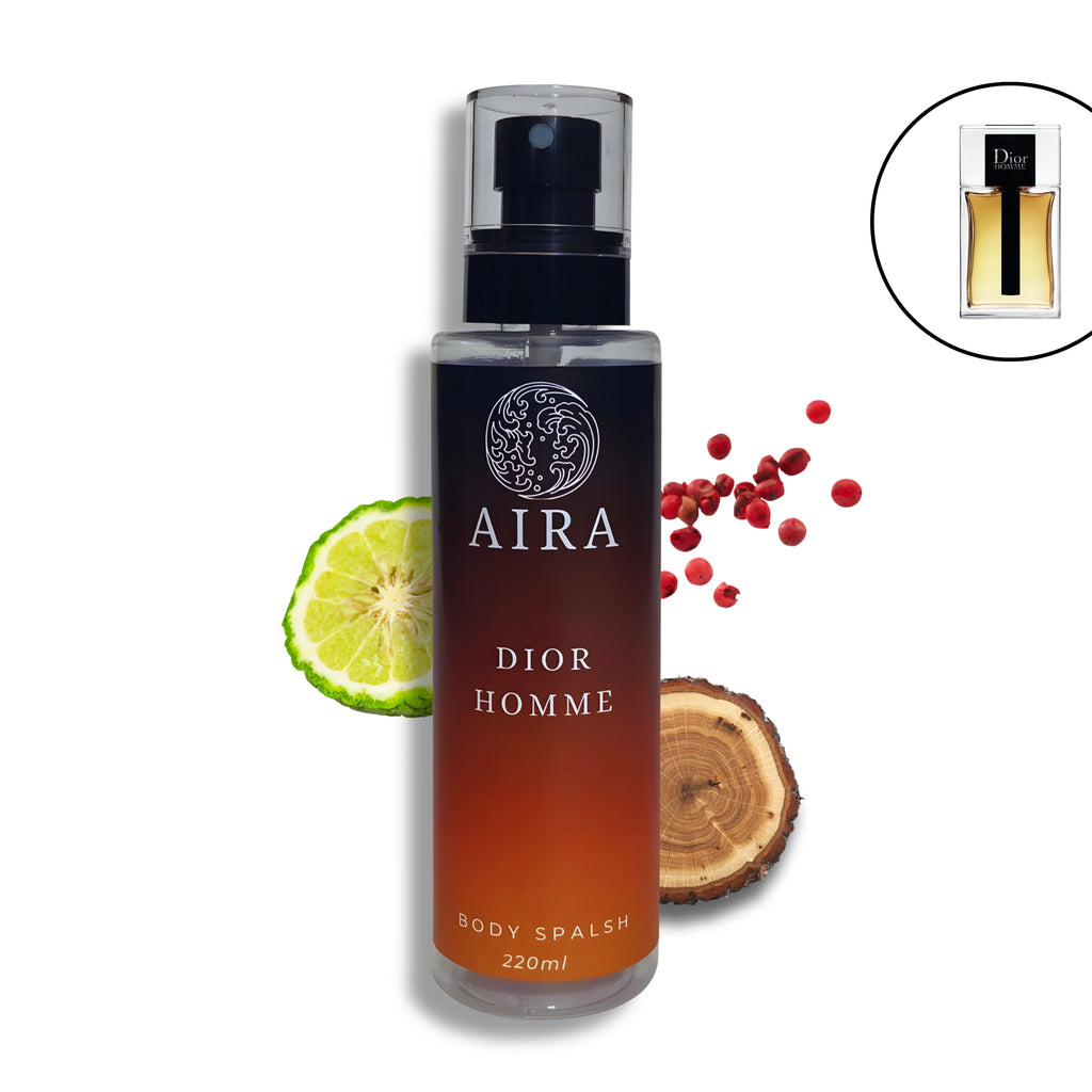 Dior Homme body splash bottle with lime, wood piece, and red berries on a white background