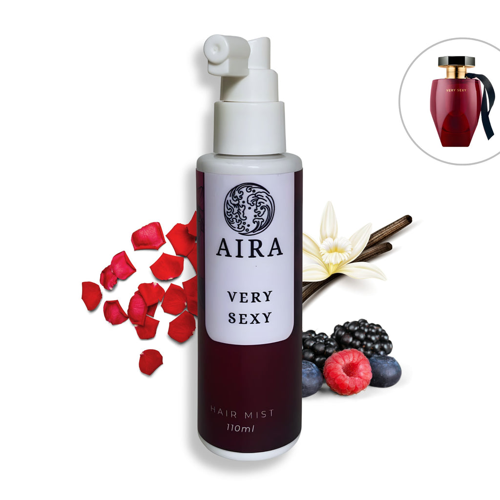 Aira Very Sexy hair mist bottle with red petals, berries, and vanilla on a white background