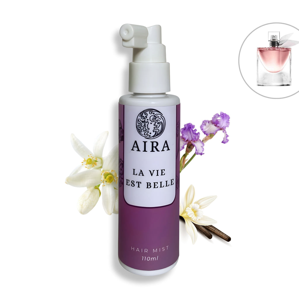 Aira hair mist bottle with flowers on a white background
