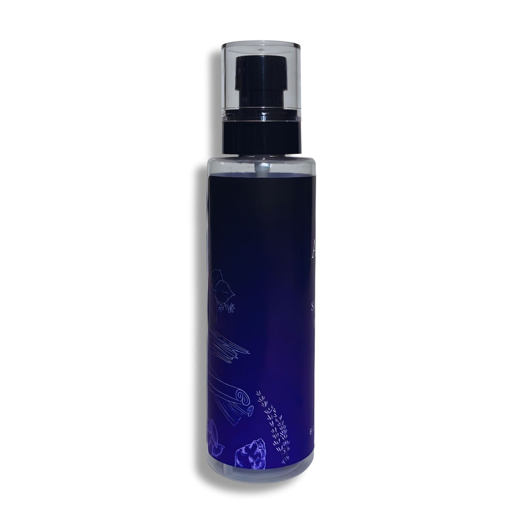 Dark blue body splash bottle with a black cap on a white background