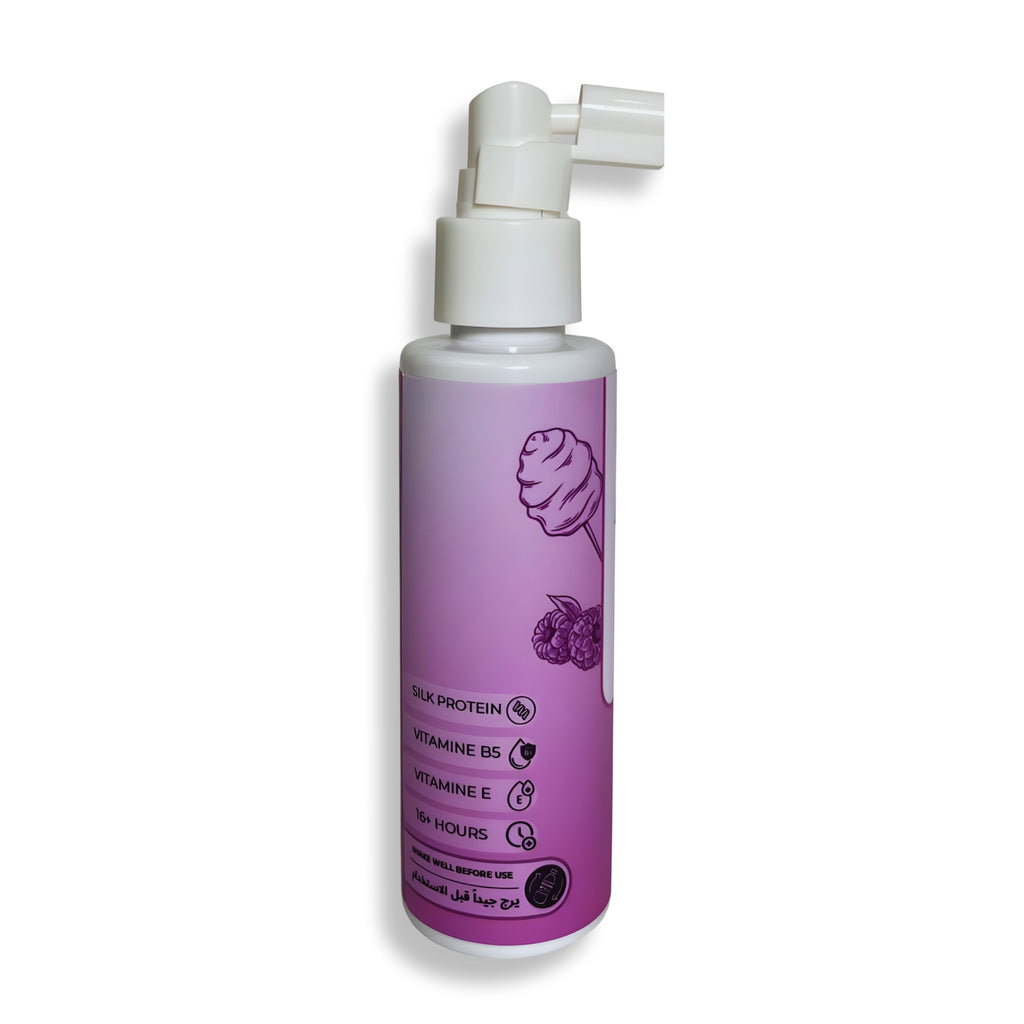 Purple hair mist bottle with white nozzle on a white background