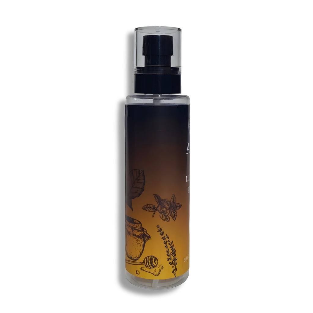 Body splash bottle with black cap on a white background