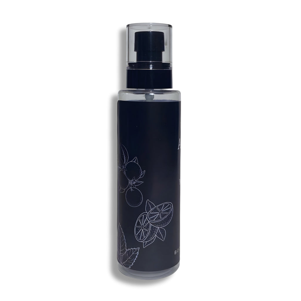 Black body splash bottle with silver nozzle on a white background