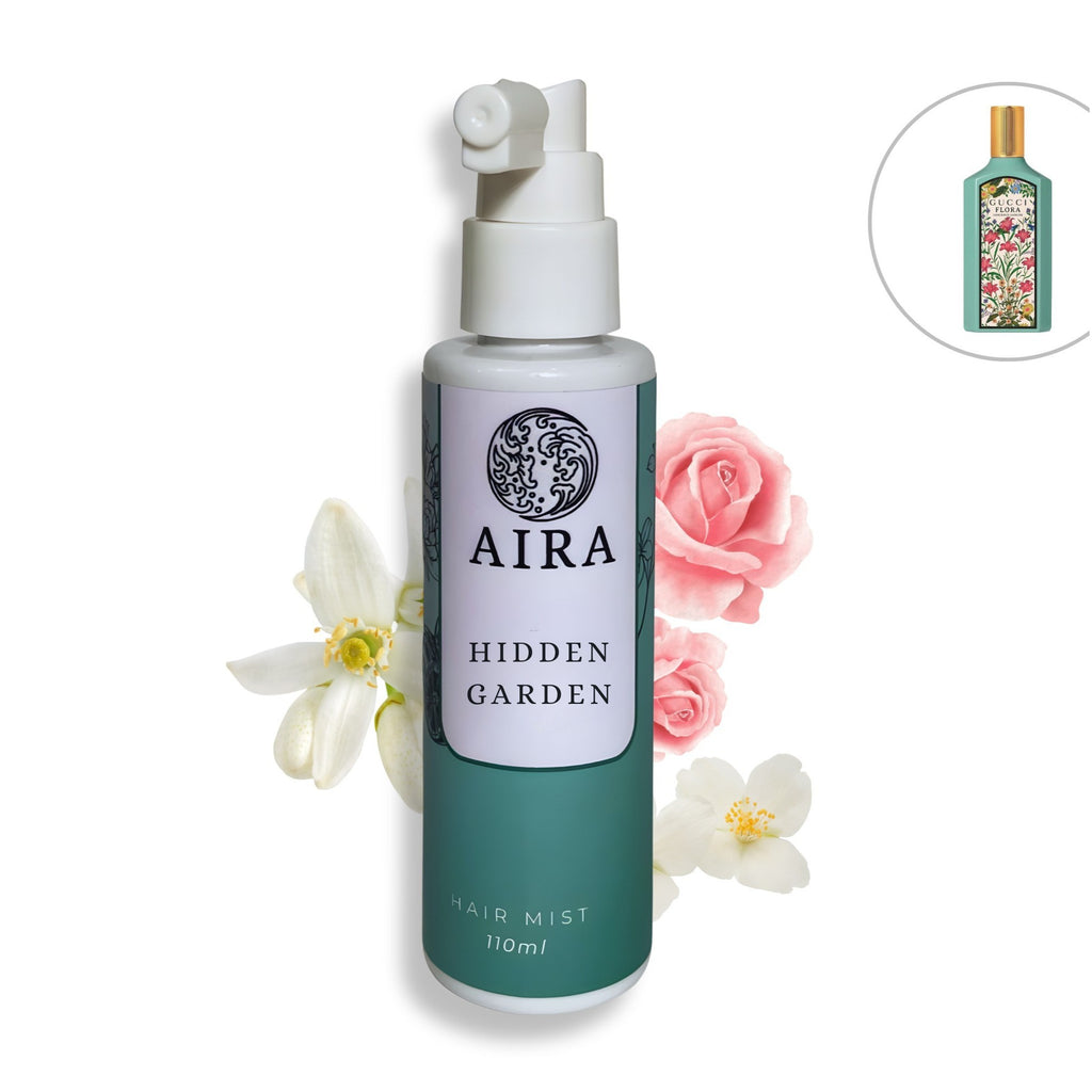 Aira Hidden Garden hair mist bottle with floral decorations on a white background dupe Gucci flora